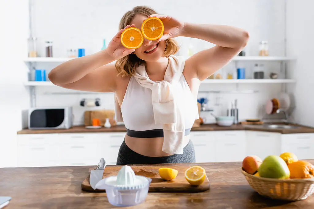 write for us health and fitness and see how girl is showing her healthy food and smiling